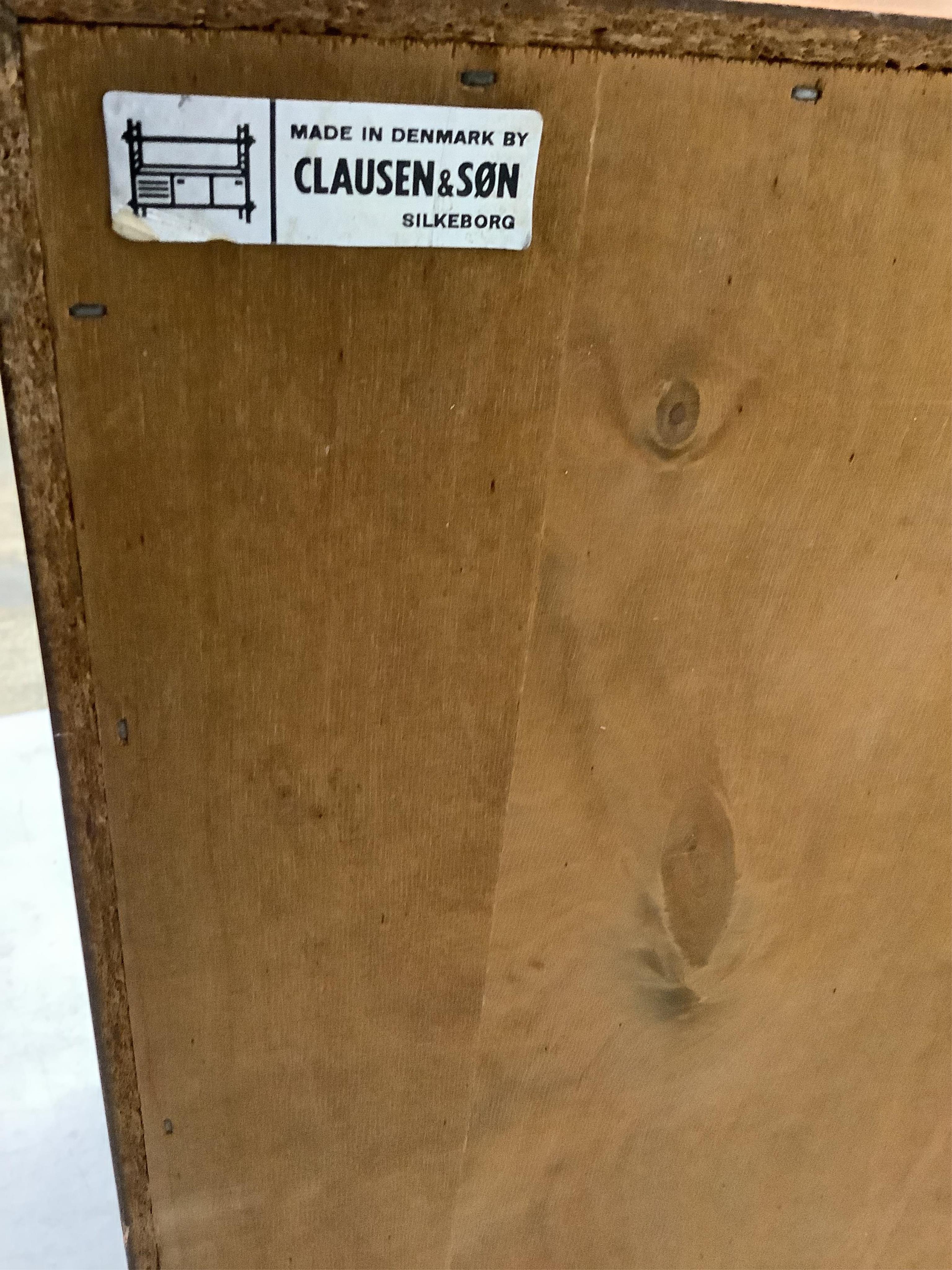 Clausen & Son, a mid century Danish teak sideboard, width 160cm, depth 45cm, height 70cm. Condition - fair